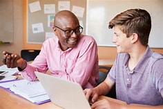 Teacher working with a student